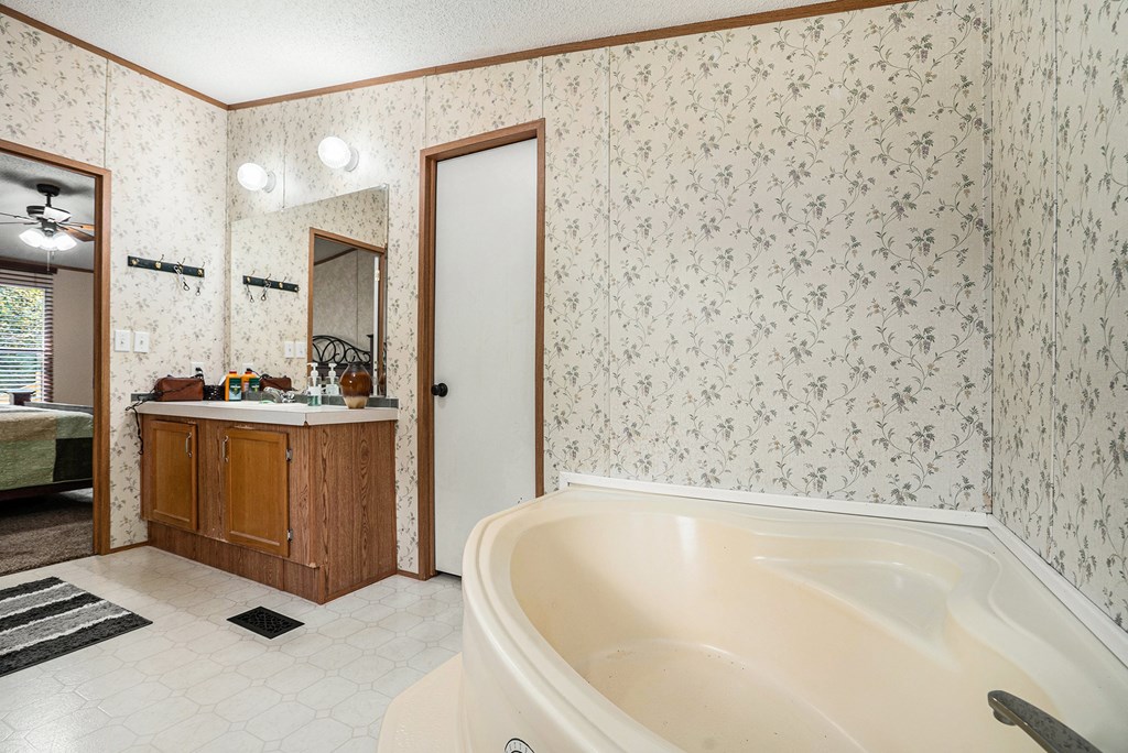 359 Norton Bridge Road Chatsworth, GA 30705 - Photo 17 of 28 a bathroom with a bathtub and a shower