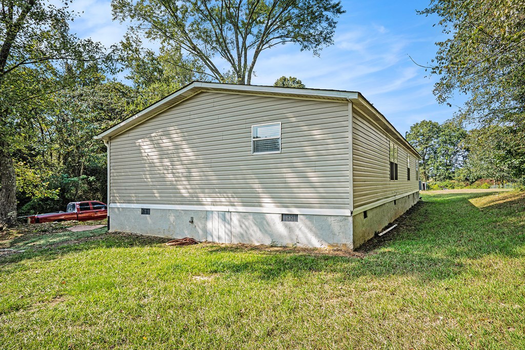 359 Norton Bridge Road Chatsworth, GA 30705 - Photo 27 of 28 a view of a house with a yard