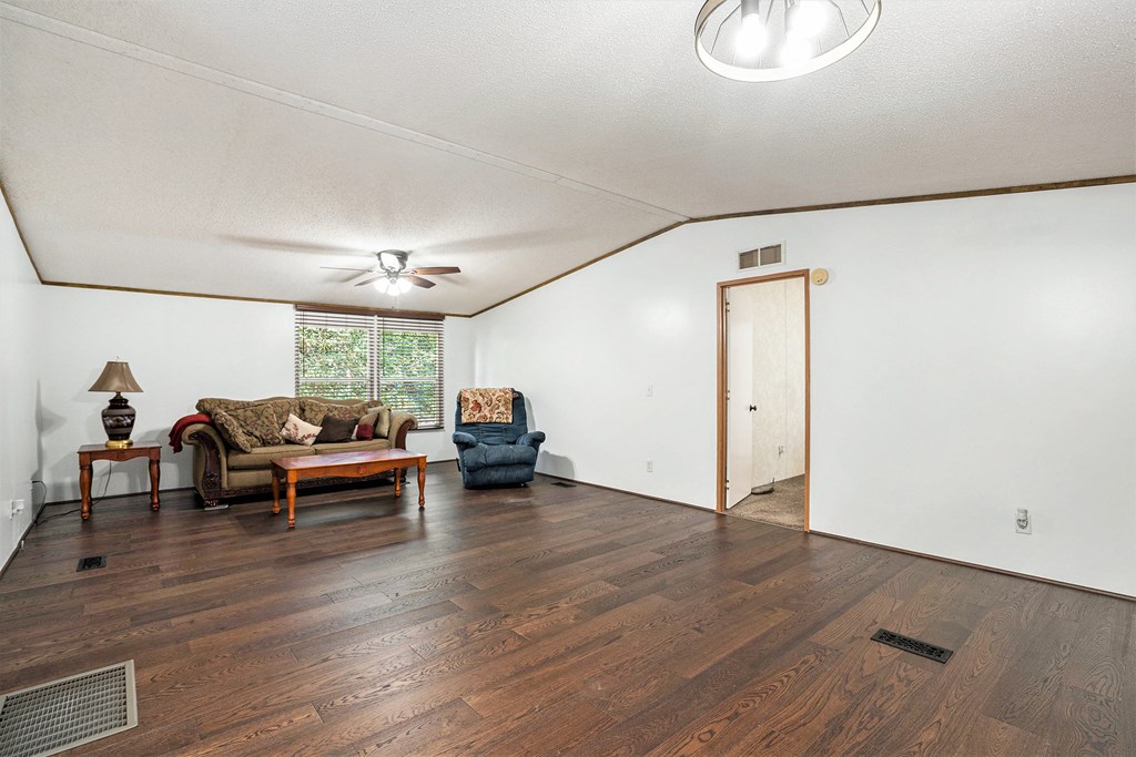 359 Norton Bridge Road Chatsworth, GA 30705 - Photo 4 of 28 a living room with furniture and a wooden floor