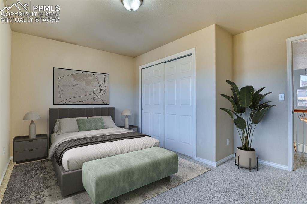 Undisclosed Address Colorado Springs, CO 80921 - Photo 19 of 49 a bedroom with a large bed and a potted plant