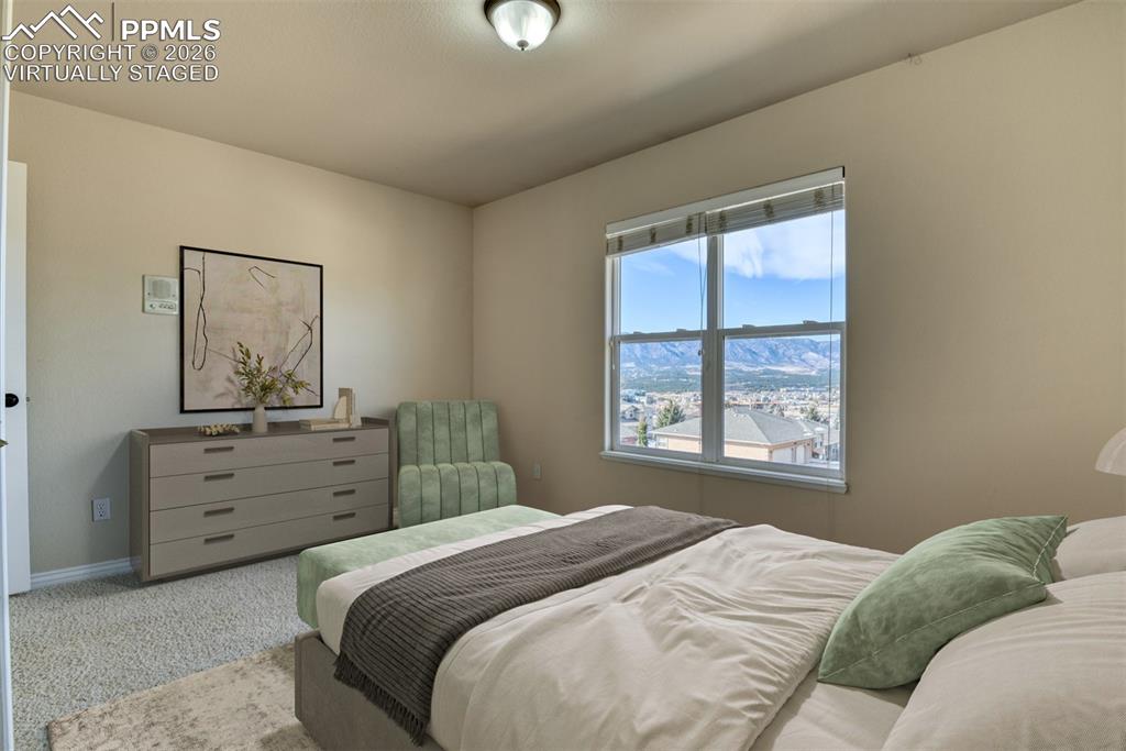 Undisclosed Address Colorado Springs, CO 80921 - Photo 20 of 49 a bedroom with a bed and a window