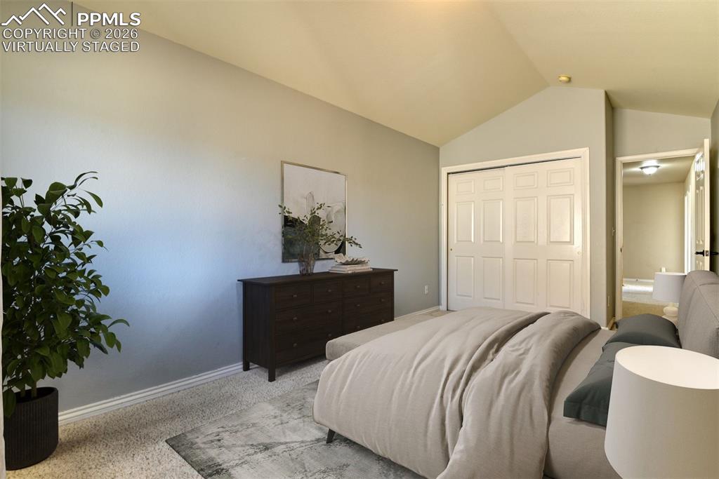 Undisclosed Address Colorado Springs, CO 80921 - Photo 21 of 49 a bedroom with a bed and a potted plant