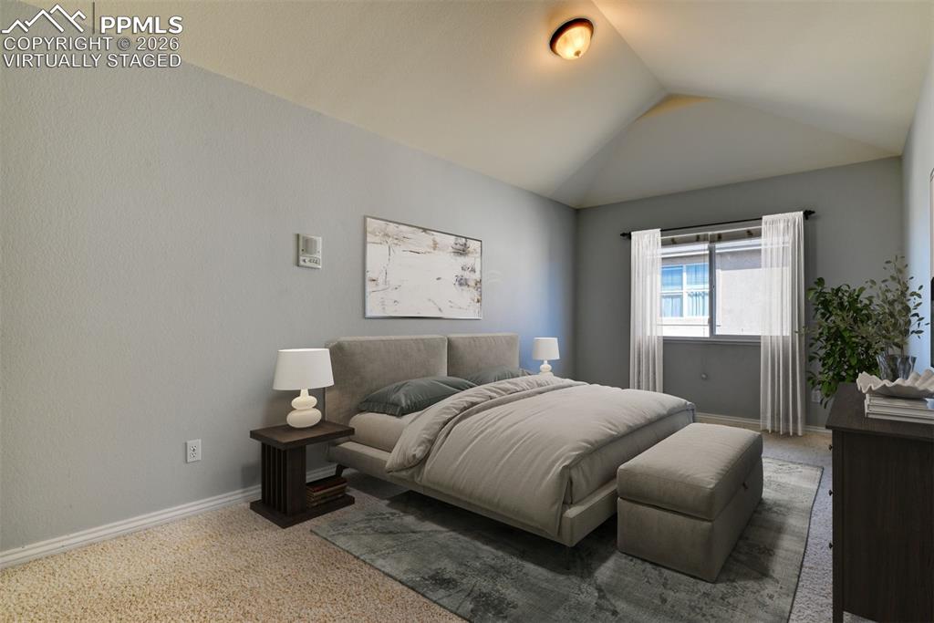 Undisclosed Address Colorado Springs, CO 80921 - Photo 22 of 49 a bedroom with a bed and a couch