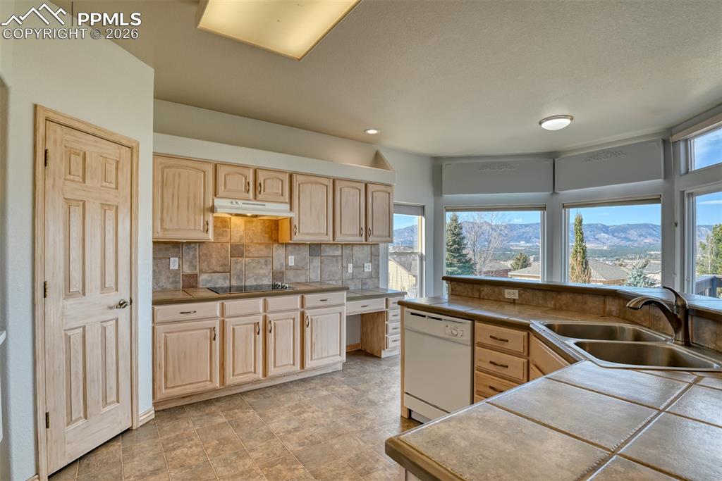 Undisclosed Address Colorado Springs, CO 80921 - Photo 24 of 49 a kitchen with stainless steel appliances granite countertop a sink and cabinets