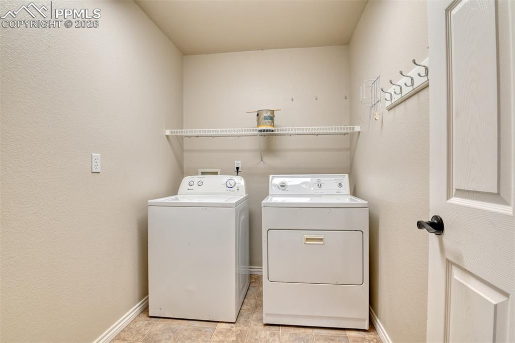 Undisclosed Address Colorado Springs, CO 80921 - Photo 25 of 49 a utility room with dryer and washer