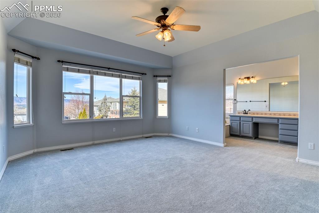 Undisclosed Address Colorado Springs, CO 80921 - Photo 37 of 49 a view of an empty room with a window and a kitchen