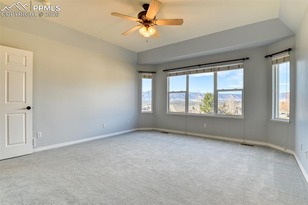Undisclosed Address Colorado Springs, CO 80921 - Photo 38 of 49 an empty room with windows and fan