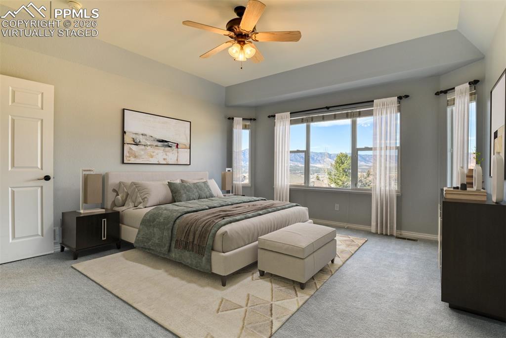 Undisclosed Address Colorado Springs, CO 80921 - Photo 7 of 49 a spacious bedroom with a large bed and a window