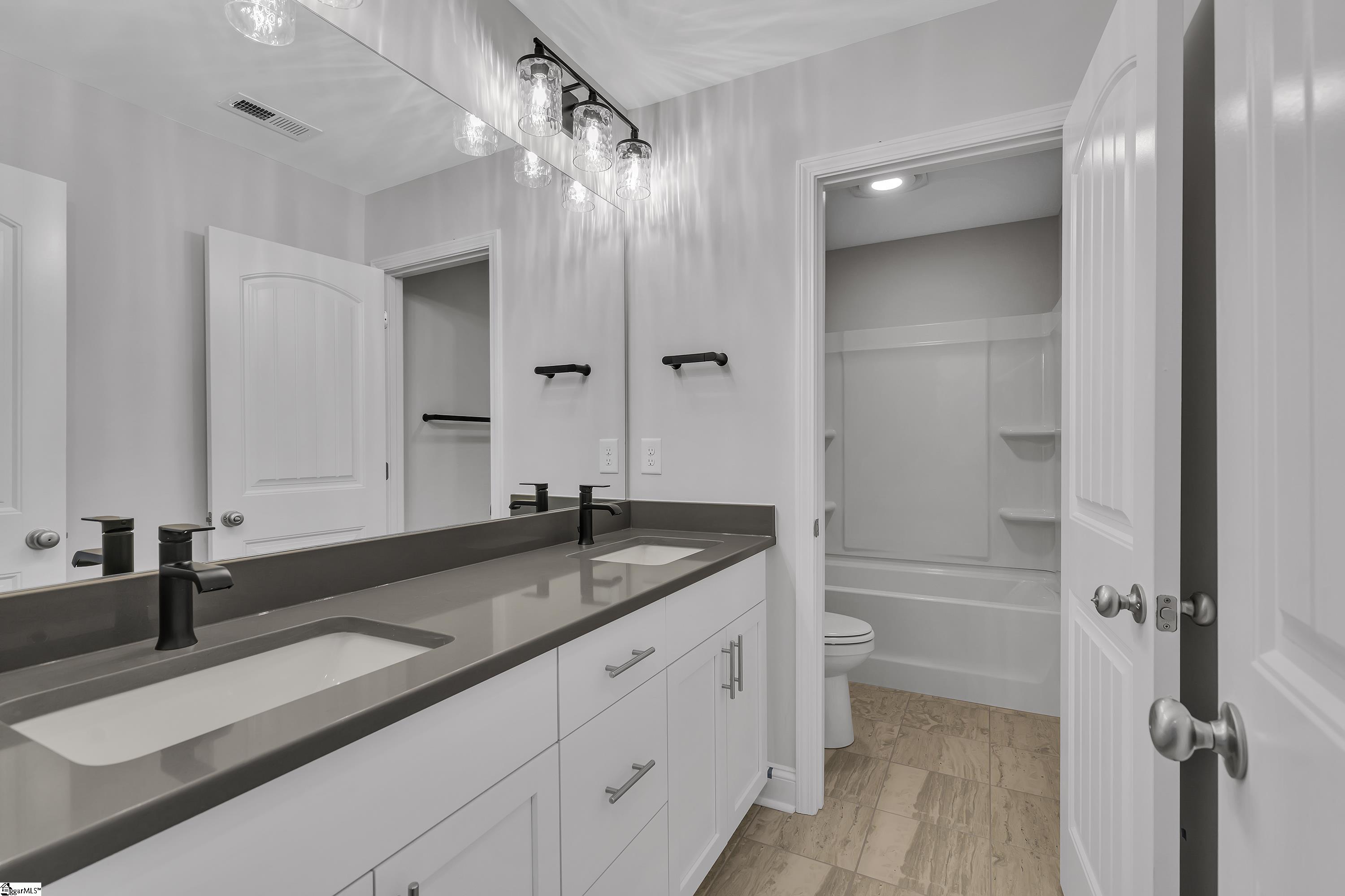 8 Red Lion Road, Unit SITE 15 Greenville, SC 29607 - Photo 20 of 23 Featuring double vanities, upgraded quartz, upgraded cabinetry featuring soft-close drawers and doors-