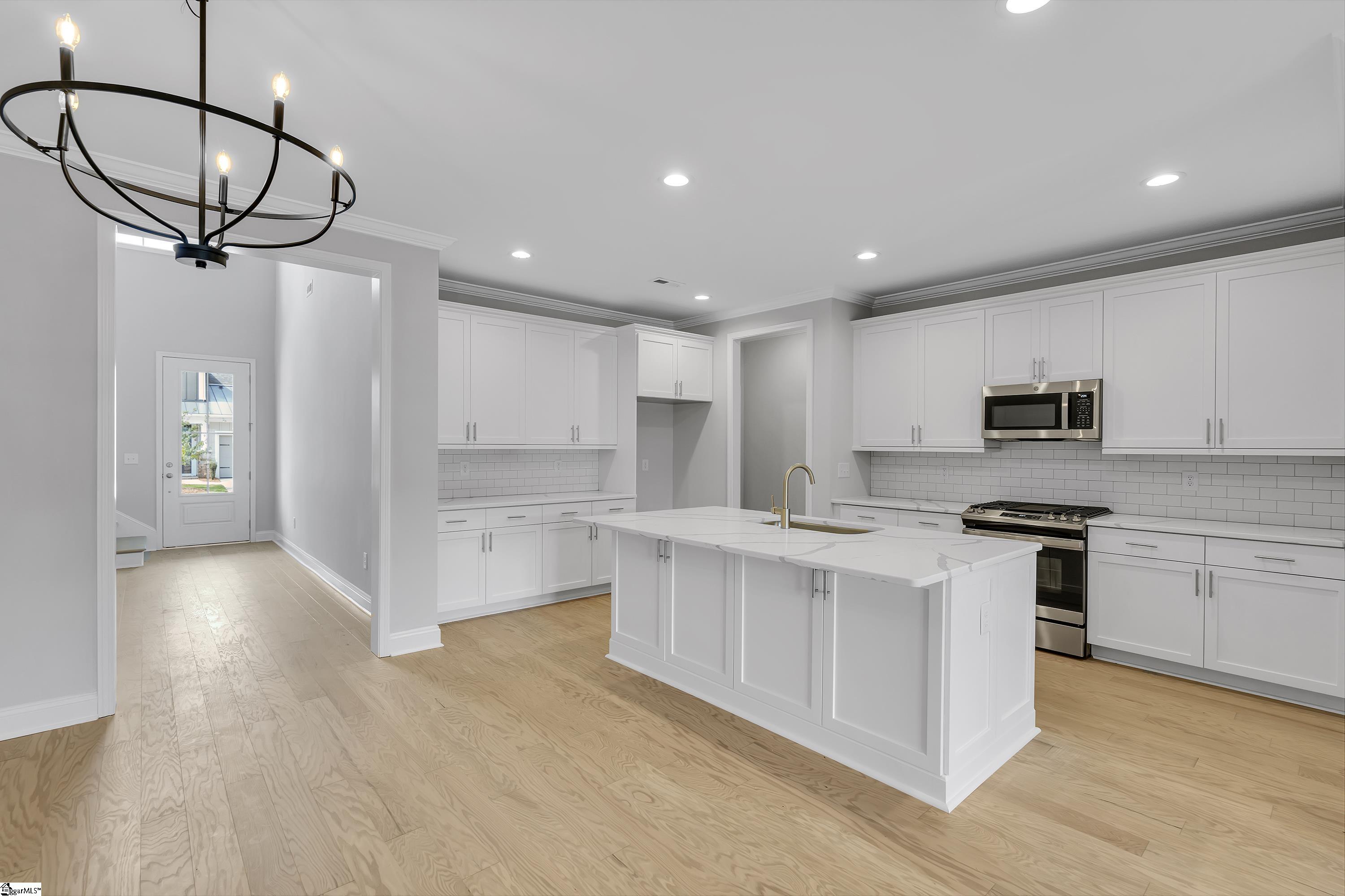 8 Red Lion Road, Unit SITE 15 Greenville, SC 29607 - Photo 3 of 23 Additional cabinets for storage, upgraded island, single bowl ss sink, gas appliance package, under cabinet lights, pre-wired for pendant lights, and much much more!
