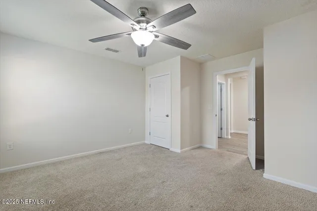 a kitchen with stainless steel appliances kitchen island granite countertop a sink a stove a microwave a dining table and chairs