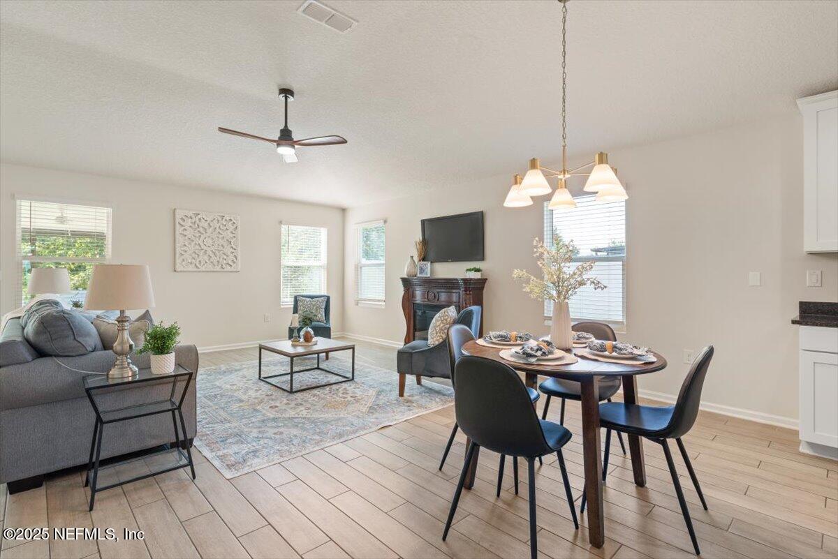 88 North Hamilton Springs Road St. Augustine, FL 32084 - Photo 23 of 73 a view of a dining room with furniture window and wooden floor