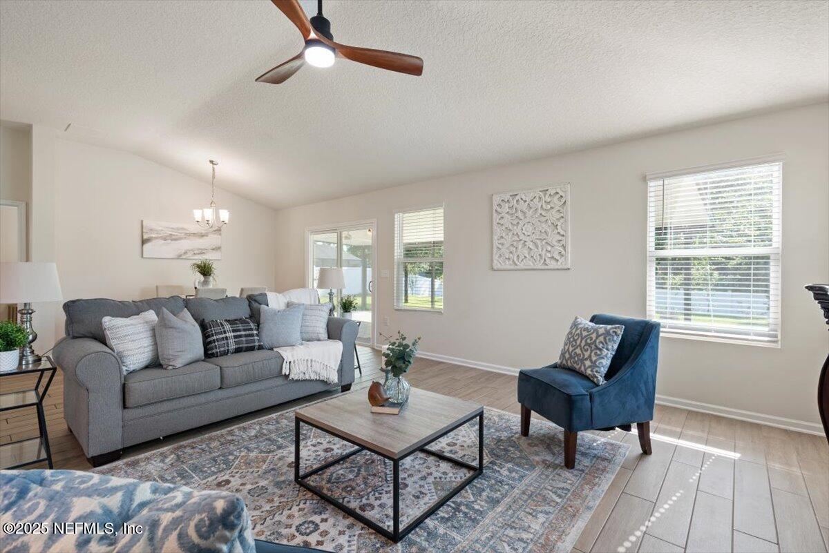 88 North Hamilton Springs Road St. Augustine, FL 32084 - Photo 24 of 73 a living room with furniture and a wooden floor