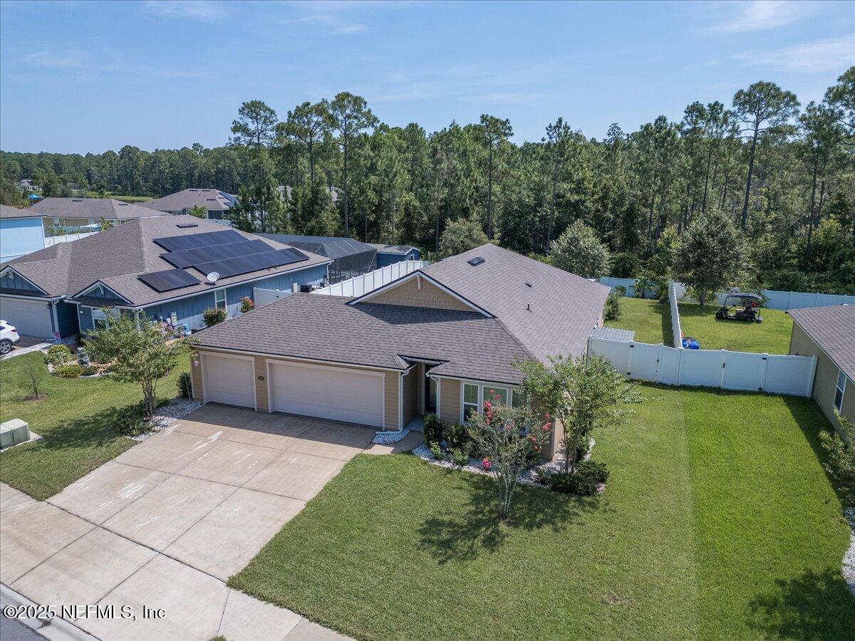 88 North Hamilton Springs Road St. Augustine, FL 32084 - Photo 3 of 73 a aerial view of a house with a yard and a garage