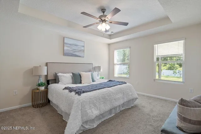 a view of a house with backyard and porch