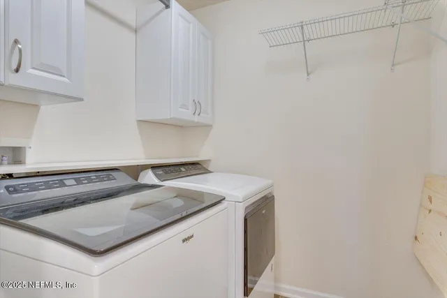 an aerial view of a house with a big yard