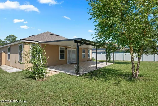 a view of a swimming pool with an outdoor seating