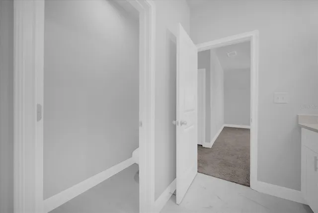 a view of hallway with closet