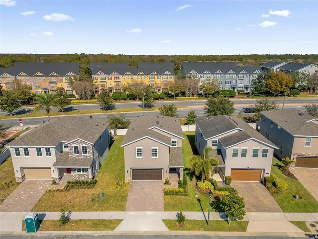 an aerial view of a house with a ocean view