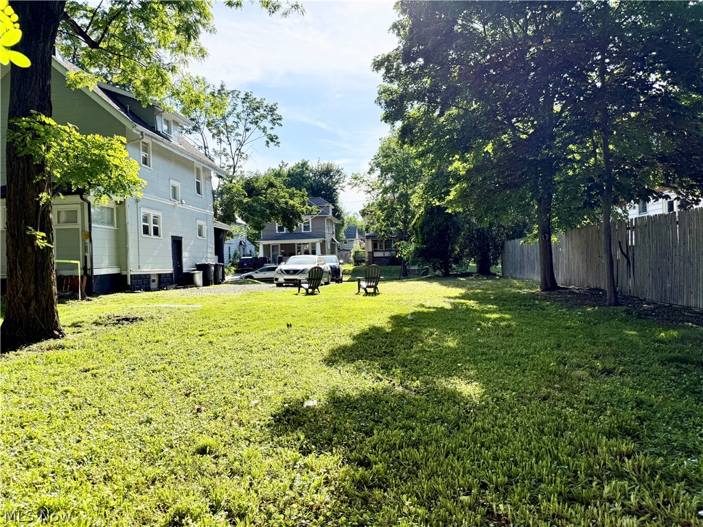 869 Berwin Street Akron, OH 44310 - Photo 2 of 16 Side exterior view of home featuring spacious fenced yard