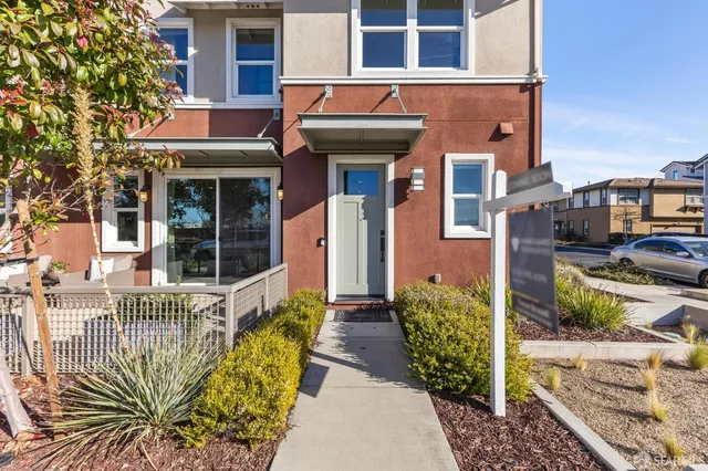 a front view of a building with garden