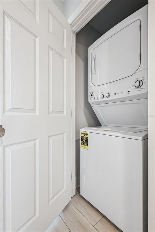 8774 Worldquest Boulevard, Unit 7307 Orlando, FL 32821 - Photo 29 of 52 a utility room with dryer and washer