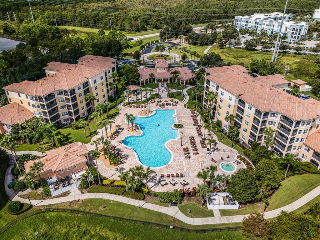 8774 Worldquest Boulevard, Unit 7307 Orlando, FL 32821 - Photo 51 of 52 an aerial view of residential houses with outdoor space