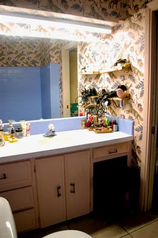 a bathroom with a sink and a mirror
