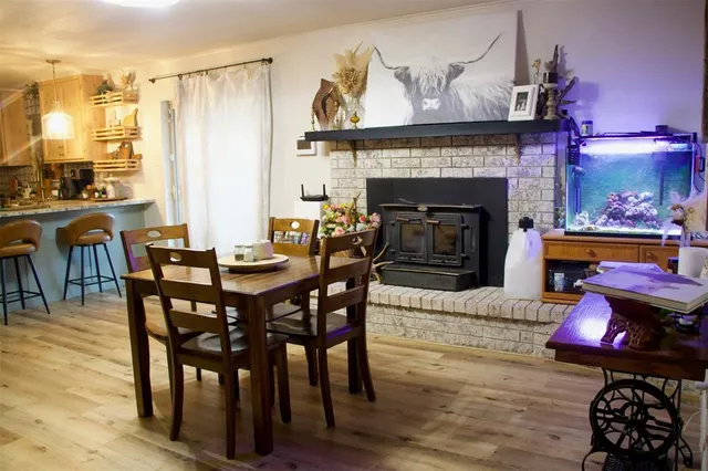 a dining room with furniture and window