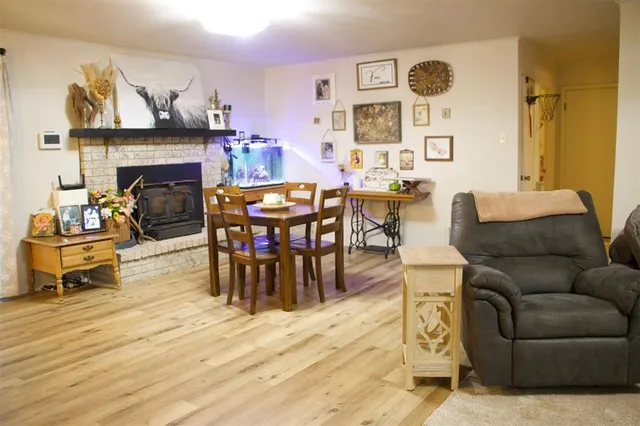 a living room with furniture and fireplace