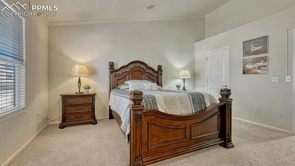 a living room with furniture and a dresser