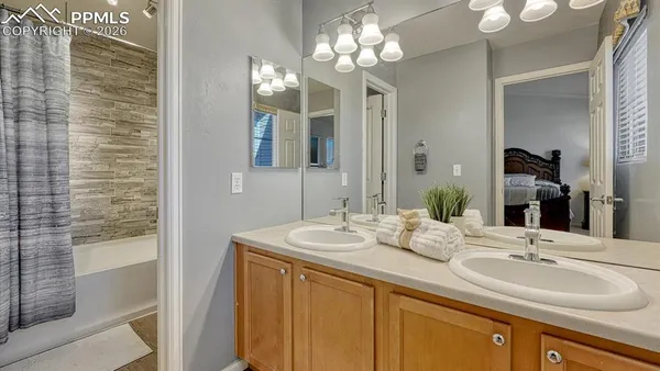 a bathroom with a sink double vanity and a mirror