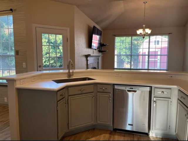 a kitchen that has a sink and a window