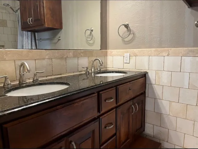 a kitchen with a sink and a stove