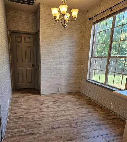 a view of a closet area with ceiling fan