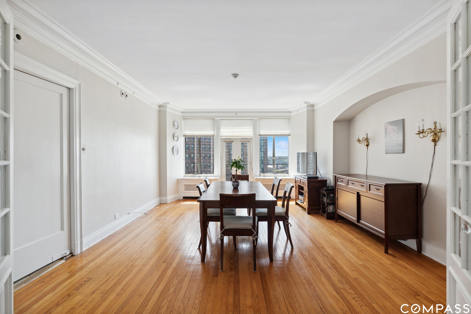 Undisclosed Address Chicago, IL 60613 - Photo 11 of 19 a view of a dining room with furniture and wooden floor