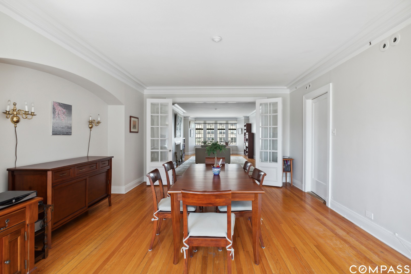 Undisclosed Address Chicago, IL 60613 - Photo 12 of 19 a view of a dining room with furniture window and wooden floor