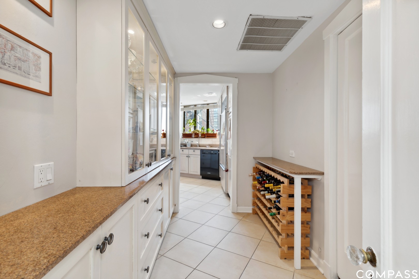 Undisclosed Address Chicago, IL 60613 - Photo 7 of 19 a kitchen with granite countertop a sink and cabinets