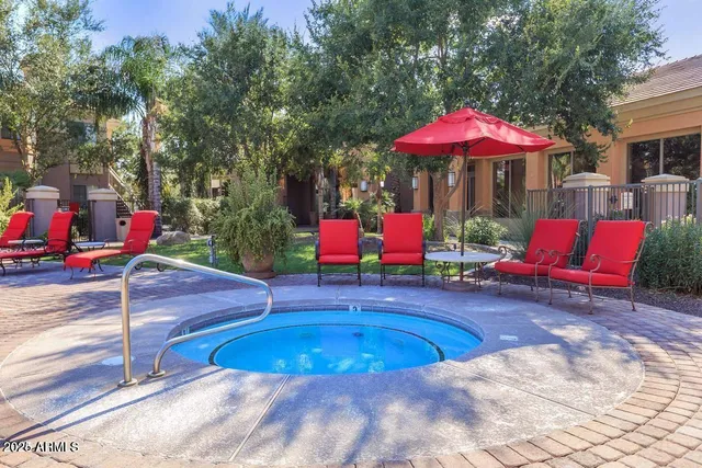 a swimming pool with outdoor seating