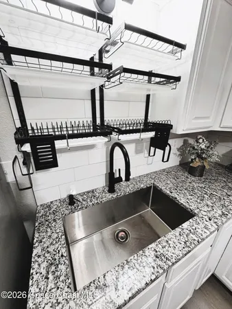 a view of a hallway with staircase