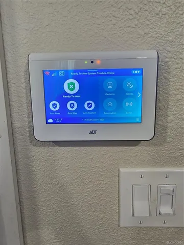 a view of a backyard with large tree