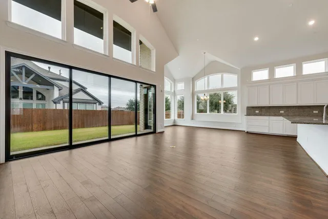a view of an entryway with wooden floor