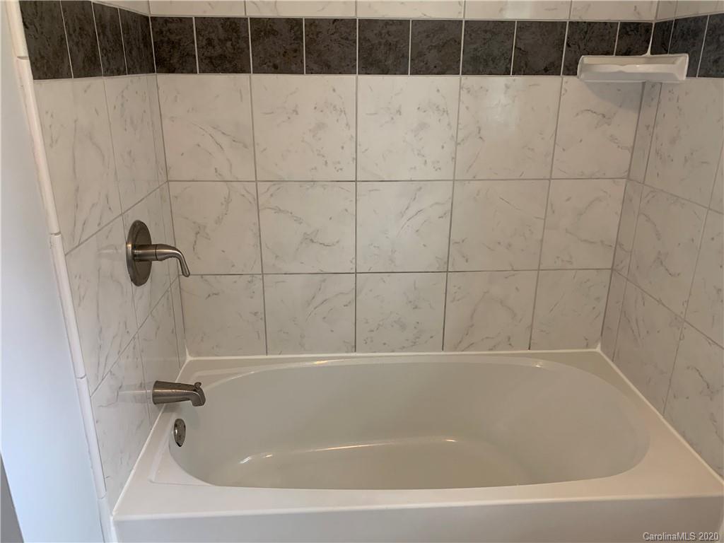 4477 Cureton Ferry Road Catawba, SC 29704 - Photo 14 of 20 a bathroom with a bathtub