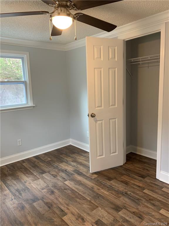 4477 Cureton Ferry Road Catawba, SC 29704 - Photo 16 of 20 a view of an empty room with wooden floor and a window