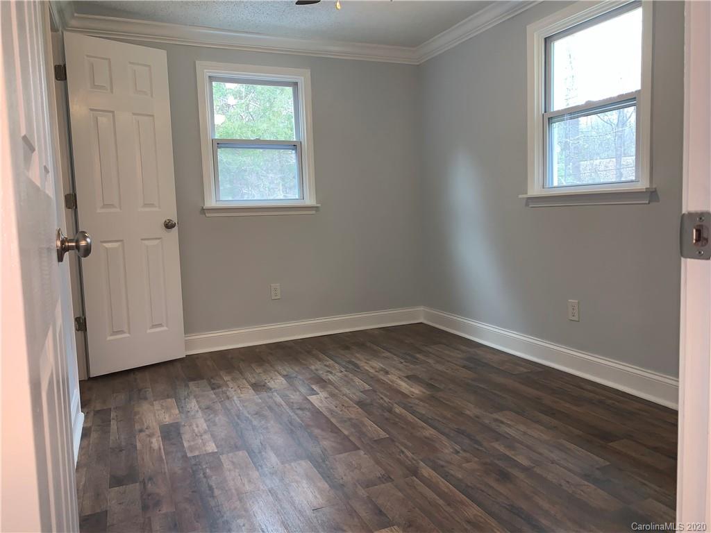 4477 Cureton Ferry Road Catawba, SC 29704 - Photo 19 of 20 an empty room with wooden floor and windows