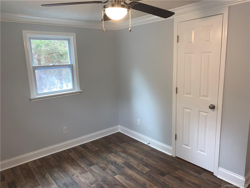 4477 Cureton Ferry Road Catawba, SC 29704 - Photo 20 of 20 an empty room with wooden floor and windows