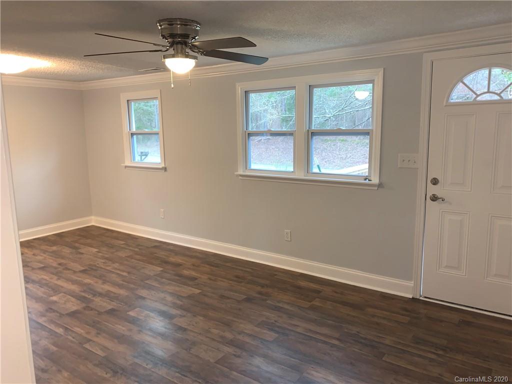 4477 Cureton Ferry Road Catawba, SC 29704 - Photo 7 of 20 a view of empty room with wooden floor and fan