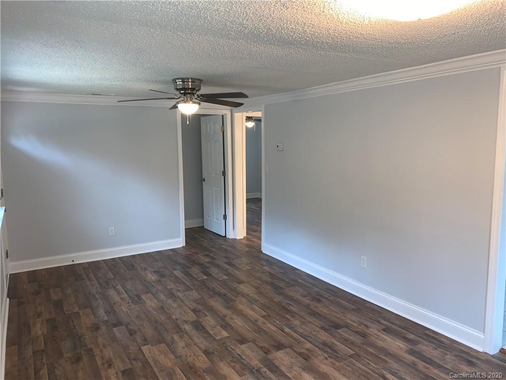 4477 Cureton Ferry Road Catawba, SC 29704 - Photo 8 of 20 a view of an empty room with wooden floor