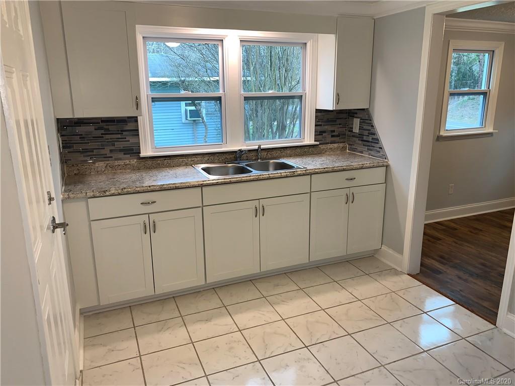 4477 Cureton Ferry Road Catawba, SC 29704 - Photo 9 of 20 a kitchen with a sink and cabinets