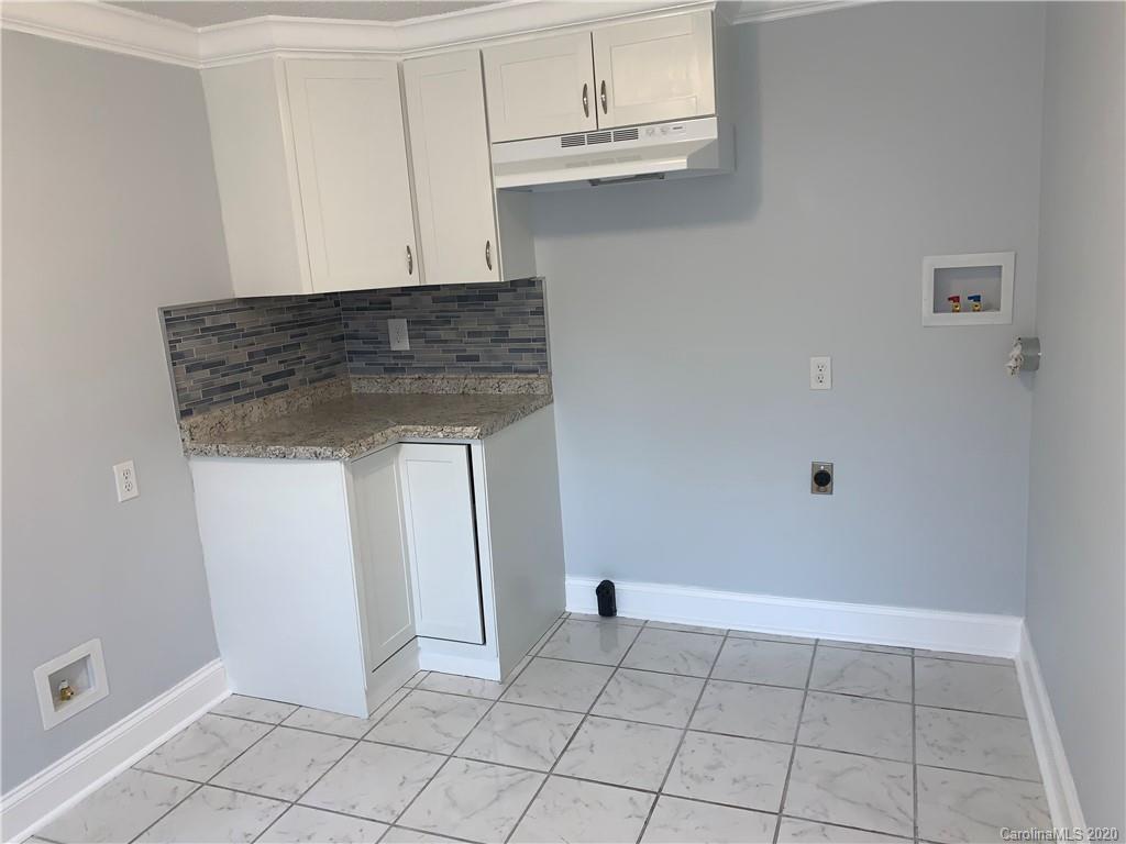 4477 Cureton Ferry Road Catawba, SC 29704 - Photo 10 of 20 a kitchen with white cabinets